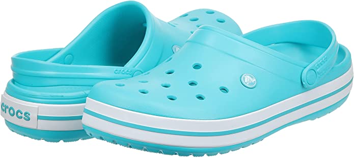 Teal blue Crocs with white stripe at bottom.